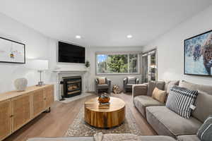 Living room with light hardwood / wood-style floors