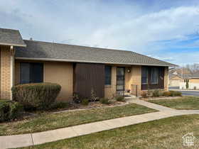 Single story home with a front yard