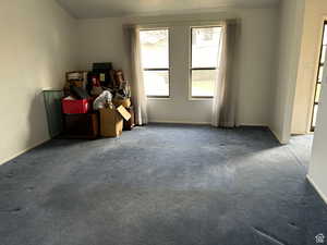 Empty room with dark carpet