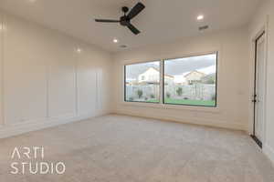 Unfurnished room with light carpet and ceiling fan