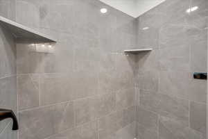 Bathroom featuring a tile shower