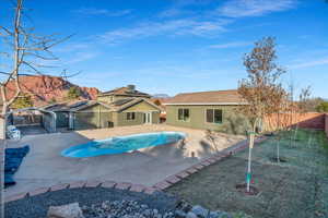 View of pool featuring a patio and a lawn