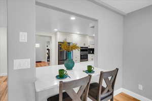 Dining area featuring light hardwood / wood-style flooring