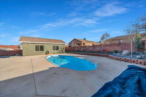 View of swimming pool with a patio