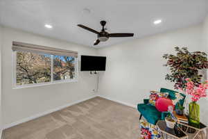 Playroom featuring carpet floors and ceiling fan