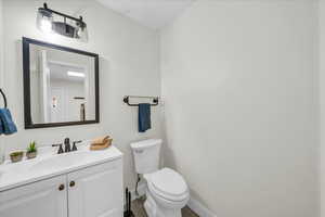 Bathroom with vanity and toilet