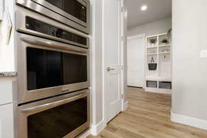 Kitchen featuring stainless steel appliances and light wood-type flooring