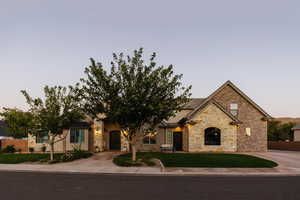 View of front facade with a lawn