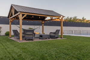 View of yard with a gazebo and a patio area