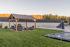 View of yard with a mountain view, a gazebo, and a patio