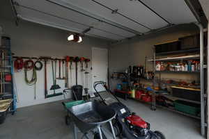 Garage featuring a garage door opener