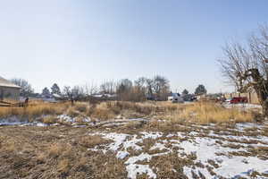 View of yard covered in snow