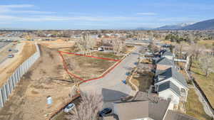 Birds eye view of property with a mountain view