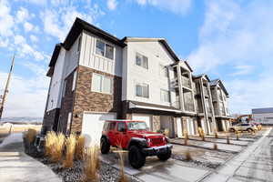 View of property with a garage