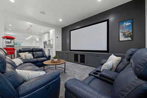 Cinema room featuring carpet floors and recessed lighting