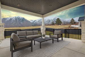 View of patio featuring a mountain view and an outdoor living space