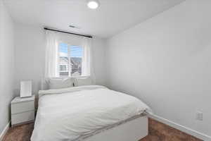 View of carpeted bedroom