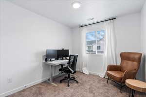 View of carpeted home office