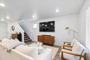 Living room with dark hardwood / wood-style flooring