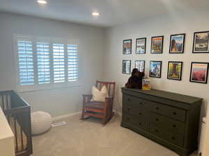 Living area with light carpet