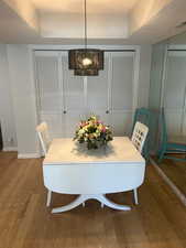 Dining space with hardwood / wood-style floors