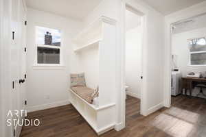 Mudroom featuring dark hardwood / wood-style floors and washer / dryer