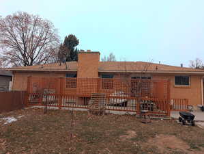 Back of house with a deck