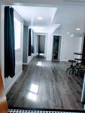 Corridor featuring wood-type flooring