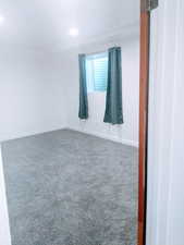 Empty room with carpet flooring
