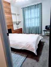 Bedroom featuring ceiling fan and carpet flooring