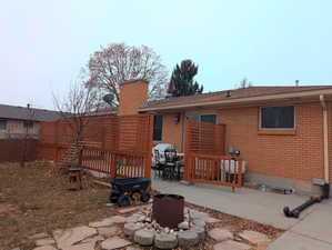 Rear view of property featuring a patio area