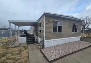 View of side of home with a deck