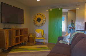 Living room with hardwood / wood-style flooring