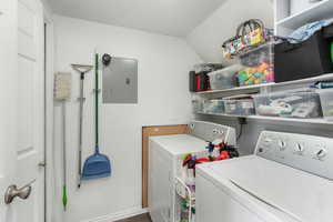 Clothes washing area with washer and dryer and electric panel