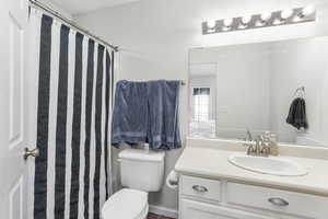 Bathroom with vanity and toilet