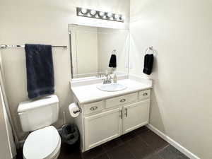 Primary Bathroom featuring vanity and toilet