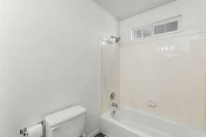 2nd bathroom upstairs with toilet and shower / bathing tub combination