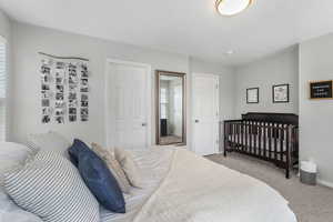 Bedroom with light colored carpet