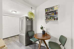 Dining area with light hardwood / wood-style floors