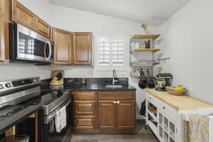 Kitchen with New Vinyl flooring, Microwave, Range