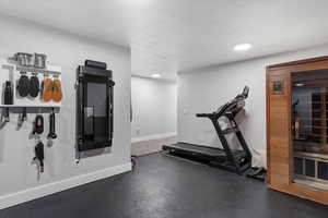 Exercise area with a textured ceiling