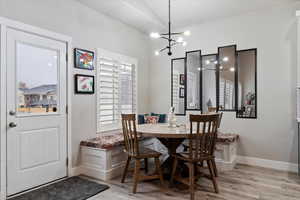 Dining area featuring plenty of natural light, light wood-type flooring, and breakfast area