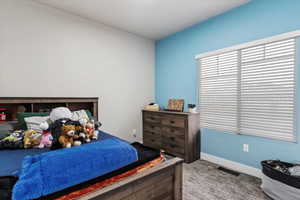 Bedroom featuring carpet