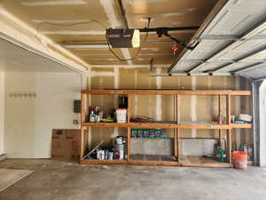 Garage featuring a garage door opener