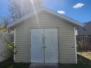 View of shed with fence
