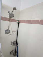 Full bathroom with a tile shower