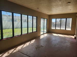 Unfurnished sunroom with a wealth of natural light