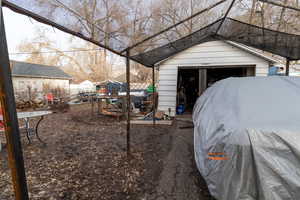 Backyard featuring detached garage