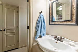 Bathroom with sink and a textured ceiling