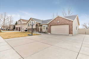 View of front facade with a garage and a front yard